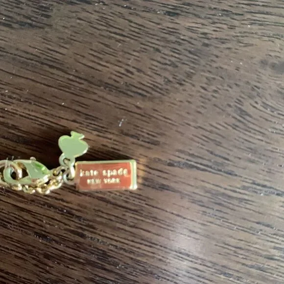 KATE Spade enamel/gold bow gold tone chain necklace